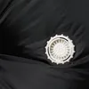 A close-up view of a white vent on a black fabric. Produktbild-Vorschau