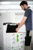 A man is interacting with a stack of storage containers. Produktbild-Vorschau