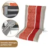 A chair cushion with a striped and patterned design, shown with close-up insets demonstrating how it attaches to a chair. Produktbild-Vorschau