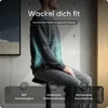 A person sitting on a stool, with anatomical highlights showing core muscles. Produktbild-Vorschau