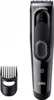 A black electric hair clipper and a comb attachment are shown against a white background. Náhľad obrázku produktu