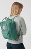 A woman wearing a green backpack. Náhled obrázku produktu