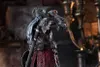 A detailed shot of an action figure, likely a collectible, in a dark, atmospheric setting. Produktbild-Vorschau