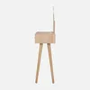 Side view of a light wood vanity table with a mirror and two drawers, standing on four tapered legs. Produktbild-Vorschau