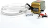 A portable oil extraction pump with hoses and clamps, set against a white background. Podgląd zdjęcia produktu