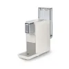 A white Tchibo Qbo coffee machine with a transparent water tank is shown against a white background. Produktbild-Vorschau