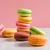 A stack of colorful macarons with a pink background. Náhled obrázku produktu