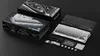 A product shot of a mechanical keyboard and its packaging, laid out on a black surface. Produktbild-Vorschau