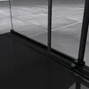 Close-up of a shower enclosure's base and frame, showing the track and glass panels. Produktbild-Vorschau