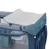 A close-up view of a baby changing station attached to a playpen. Produktbild-Vorschau
