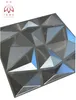 A 3D geometric wall panel with a brushed metal finish. Produktbild-Vorschau