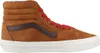 A side view of a brown Vans Sk8-Hi sneaker with red laces. Voir les images du produit