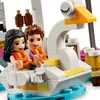 Two LEGO Friends figures, Emma and Olivia, wearing orange life vests, are seated in a white and yellow swan-shaped boat. Náhled obrázku produktu