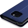 A close-up view of a blue flip case for a smartphone, showing the camera cutout. Náhľad obrázku produktu