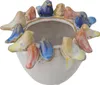 A ceramic pot decorated with small colorful birds around the rim. Produktbild-Vorschau