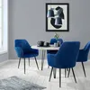 A dining set with four blue velvet chairs around a marble-topped table, with a framed abstract artwork on the wall. Náhled obrázku produktu