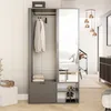 A modern entryway with a wardrobe, mirror, and shoes. Voir les images du produit