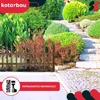 A garden fence in a landscaped garden with stairs and various plants. Náhled obrázku produktu