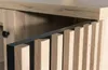 A close-up view of the slatted wooden door of a cabinet or kommode. Produktbild-Vorschau