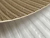 A close-up, angled view of a textured material with a wood-grain pattern. Náhled obrázku produktu