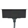 The underside of a black kitchen sink with a drain pipe attached. Produktbild-Vorschau