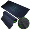 A gaming mousepad with a hexagonal pattern and a close-up of its textured underside. Náhled obrázku produktu