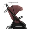 A close-up side view of a burgundy and black stroller against a white background. Náhľad obrázku produktu
