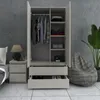 A bedroom scene with a wardrobe, nightstand, and beanbag chair. Náhľad obrázku produktu