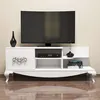 A white TV stand with a TV on top, and decorative items on the shelves. Anteprima dell’immagine prodotto