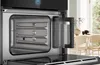Close-up view of an opened steam oven with a removable water tank. Anteprima dell’immagine prodotto