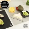 A breakfast setting with sandwiches, avocado, juice, and salad on placemats. Produktbild-Vorschau