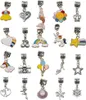 A collection of charms for bracelets, arranged in a grid. Náhled obrázku produktu