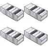 Four identical organizers filled with folded clothes. Produktbild-Vorschau
