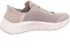 A side view of a beige Skechers slip-on sneaker with a white sole. Anteprima dell’immagine prodotto