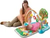 A mother is playing with her baby on a colorful playmat with a musical gym. Produktbild-Vorschau