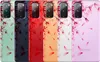 A collage of five different colored phone cases with a floral pattern. Produktbild-Vorschau