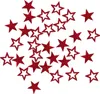 A scattered collection of red glitter stars on a white background. Produktbild-Vorschau