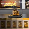 A fireplace with a fire burning, and three LED candles with fairy lights on a tray in the foreground. Below the candles are five different brightness settings for the candles. Produktbild-Vorschau