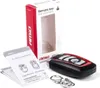 A product shot of a universal remote key and its packaging, along with an instruction manual. Voir les images du produit