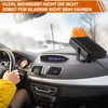 Interior of a car on a snowy day, with a car heater placed on the dashboard. Produktbild-Vorschau
