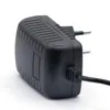A black power adapter with European plug pins and a cable is shown against a white background. Produktbild-Vorschau
