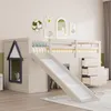 A children's loft bed with a slide and drawers, set up in a room with decorative wall art. Náhled obrázku produktu
