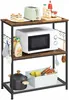 A kitchen rack filled with various kitchen appliances and utensils. Produktbild-Vorschau