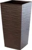 A tall, square, brown planter with a textured surface. Anteprima dell’immagine prodotto