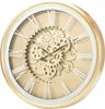A close-up, studio shot of a gold wall clock with Roman numerals and a visible gear mechanism. Anteprima dell’immagine prodotto