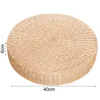 A round, woven straw cushion is shown from a slightly elevated side angle against a white background. Dimensions are indicated by text labels. Produktbild-Vorschau