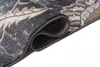 A close-up view of a rolled-up rug, showing the texture and pattern of the fabric. Náhled obrázku produktu