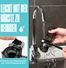 A person is cleaning a part of a juicer under a faucet. There is also text and an inset image showing a detail of the product. Podgląd zdjęcia produktu