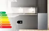 A kitchen scene with a refrigerator and an energy efficiency rating label. Produktbild-Vorschau