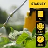 A close-up of a sprayer nozzle spraying water onto green leaves, with a yellow sprayer bottle and marketing icons in the background. Podgląd zdjęcia produktu